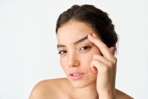 Woman Pulling on Eyebrows